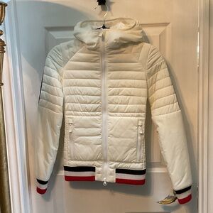 Stylish Women's Cream Ski Jacket with Red and Blue Accents